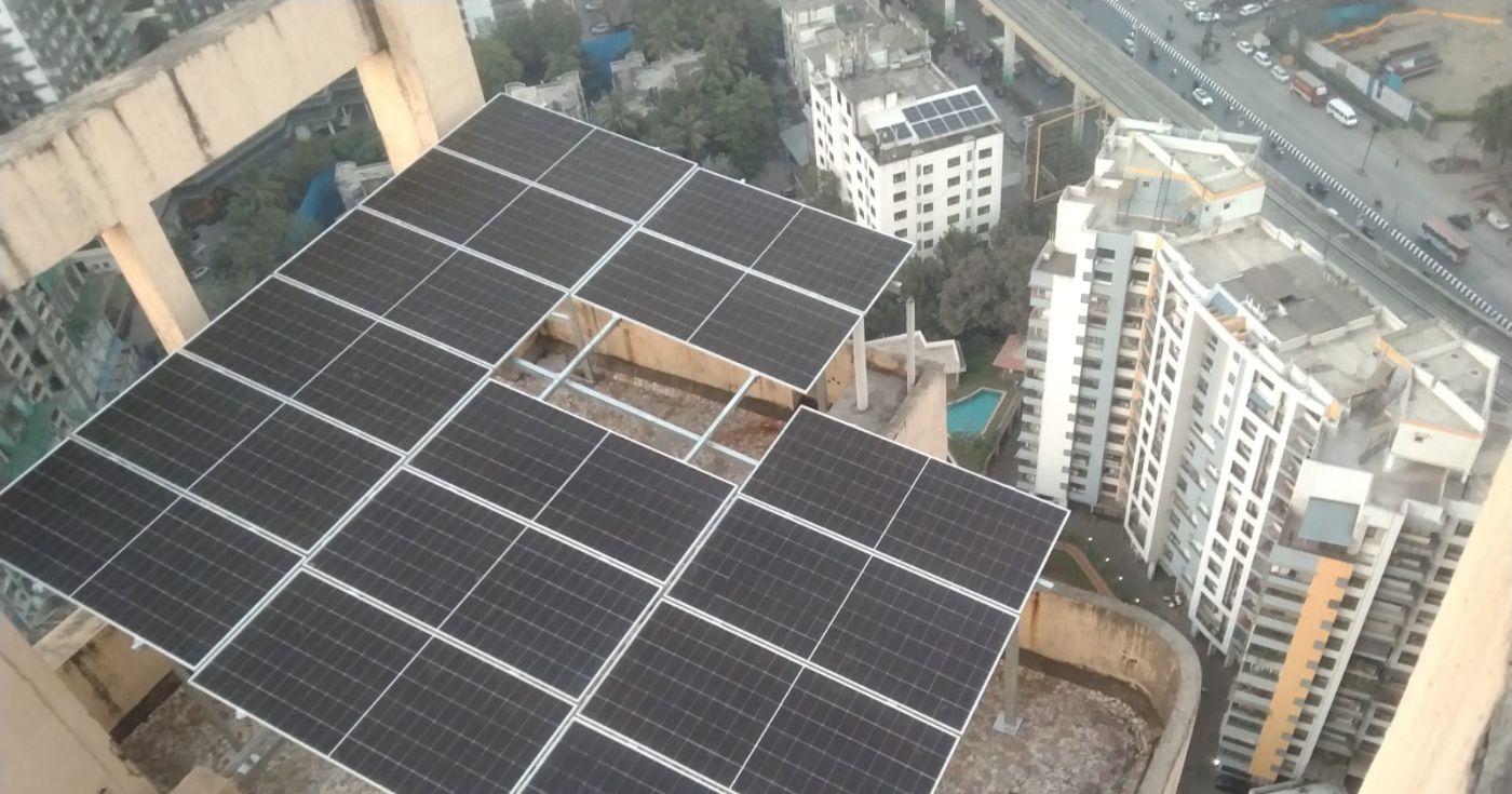 Spacefire Corp rooftop solar array on a high-rise in Kalyan